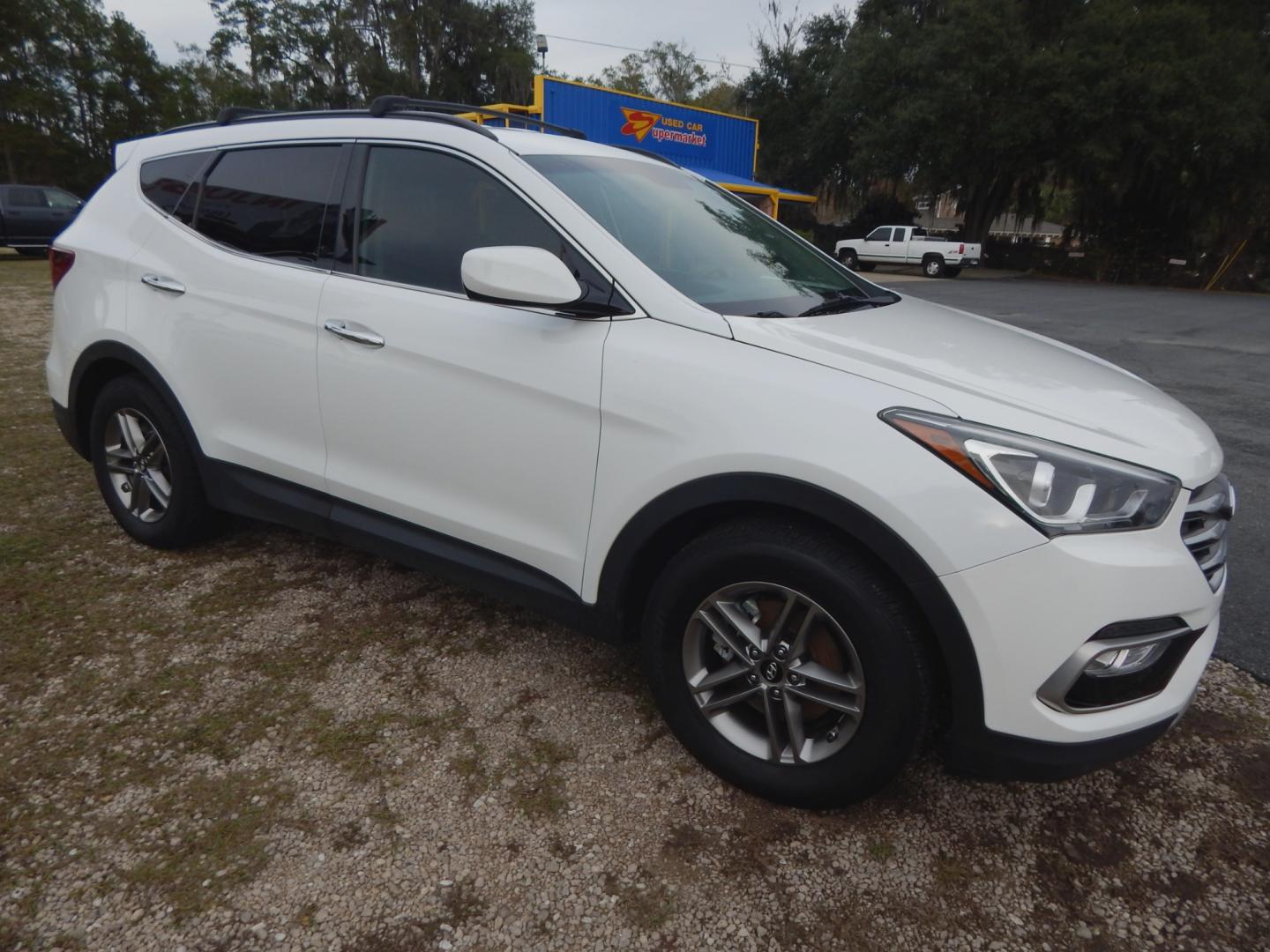 2017 White /Gray Hyundai Santa Fe Sport (5NMZU3LB8HH) with an 2.4L engine, Automatic transmission, located at 3120 W Tennessee St, Tallahassee, FL, 32304-1002, (850) 575-6702, 30.458841, -84.349648 - Used Car Supermarket is proud to present you with this loaded immaculate 2017 Hyundai Santa Fe Sport with low miles. Used Car Supermarket prides itself in offering you the finest pre-owned vehicle in Tallahassee. Used Car Supermarket has been locally family owned and operated for over 48 years. Our - Photo#1